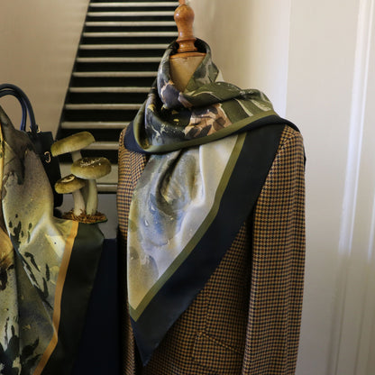 Mannequin wearing tweed jacket with Where the Salmon Leap silk scarf draped around neck | Silk Scarf | Wentworth of Yorkshire